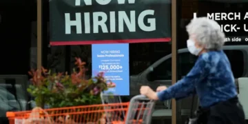 Workers at a U.S. business following release of the June employment report. - AP Photo/Nam Y. huh, File