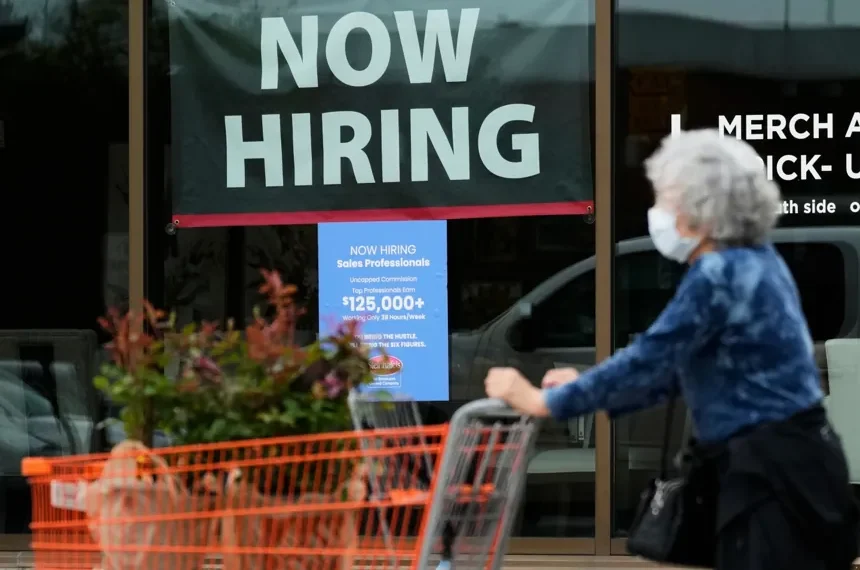 Workers at a U.S. business following release of the June employment report. - AP Photo/Nam Y. huh, File