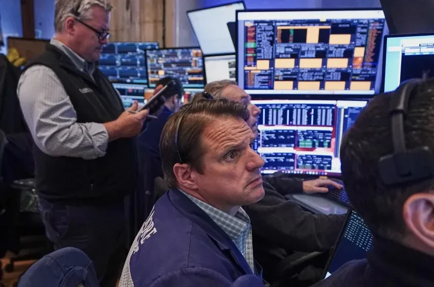 Electronic stock market display showing gains driven by AI-related shares - AP Photo/Richard Drew