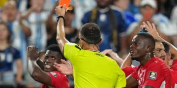 Match officials review a VAR decision during the FIFA World Cup. - AP Photo/Ed Zurga