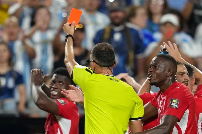 Match officials review a VAR decision during the FIFA World Cup. - AP Photo/Ed Zurga