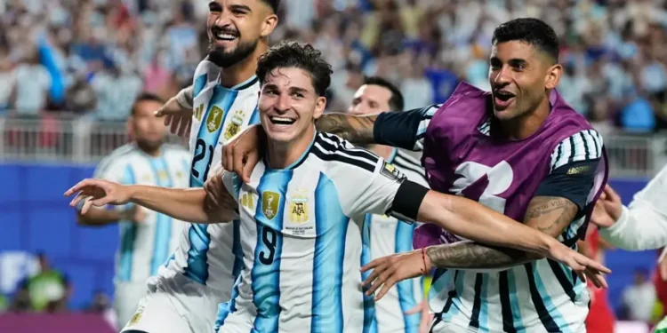 Julian Alvarez celebrates after scoring Argentina's extra-time winner against Switzerland. - AP Photo/Charflie Riedel