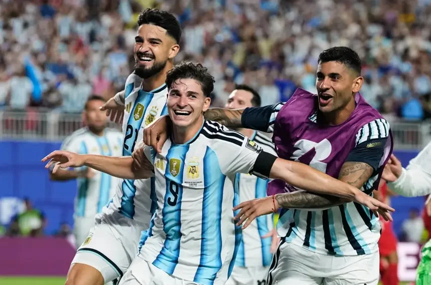 Julian Alvarez celebrates after scoring Argentina's extra-time winner against Switzerland. - AP Photo/Charflie Riedel