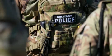 National Guard members and police respond to a shooting in downtown Memphis. - AP Photo/George Walker IV, File