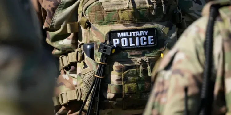 National Guard members and police respond to a shooting in downtown Memphis. - AP Photo/George Walker IV, File