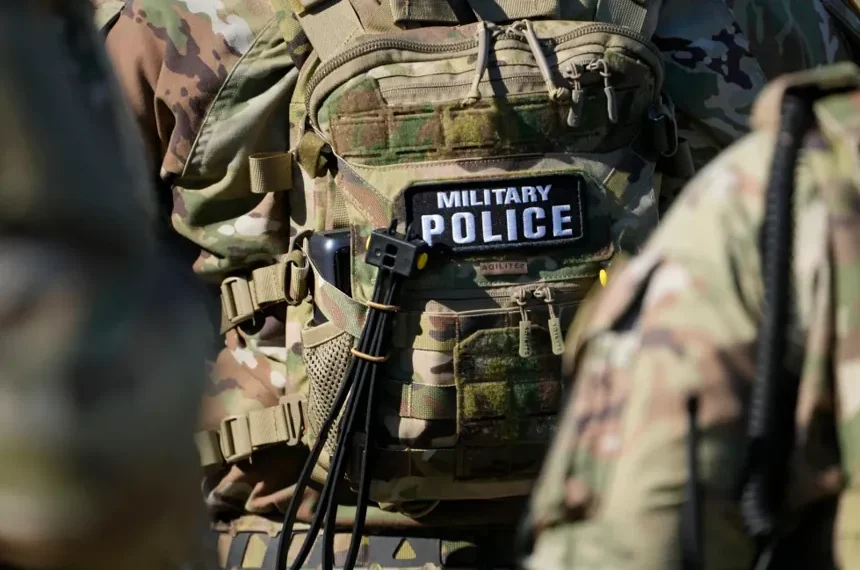 National Guard members and police respond to a shooting in downtown Memphis. - AP Photo/George Walker IV, File