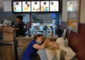 Veterinarians treat a rescued dog inside a McDonald's after Venezuela's earthquake. - AP Photo/Matias Delacroix