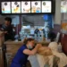 Veterinarians treat a rescued dog inside a McDonald's after Venezuela's earthquake. - AP Photo/Matias Delacroix