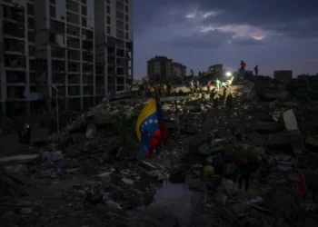 Residents search through earthquake rubble in La Guaira, Venezuela. - AP Photo/Matias Delacroix
