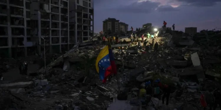 Residents search through earthquake rubble in La Guaira, Venezuela. - AP Photo/Matias Delacroix