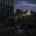 Residents search through earthquake rubble in La Guaira, Venezuela. - AP Photo/Matias Delacroix