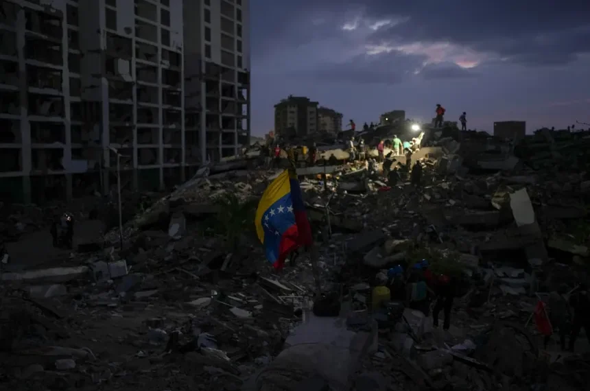 Residents search through earthquake rubble in La Guaira, Venezuela. - AP Photo/Matias Delacroix