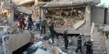 Rescue workers search damaged buildings after deadly earthquakes in Venezuela. - AP Photo/Fernando Vergara