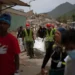 Families wait outside a temporary morgue following Venezuela's deadly earthquakes. - AP Photo/Matias Delacroix