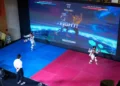 Athlete competing in Virtual Taekwondo using VR headset and motion sensors - AP Photo/Vincent Thian
