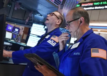 Traders monitor Wall Street as technology stocks lead market declines. - AP Photo/Richard Drew