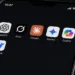 Mobile screen captured by JournosNews displaying ChatGPT, Grok, Claude, Gemini, Copilot and DeepSeek AI applications.