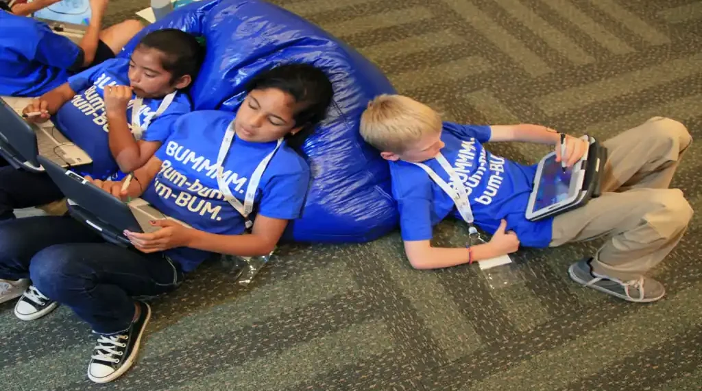 Children use tablet computers as part of school technology and digital learning activities.