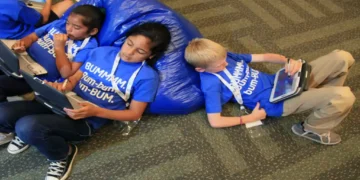 Children use tablet computers as part of school technology and digital learning activities.