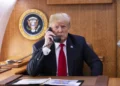 President Donald J. Trump speaks on the phone aboard Air Force One during a Hurricane Michael impact update in October 2018.