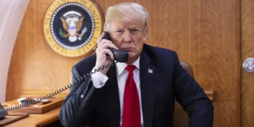 President Donald J. Trump speaks on the phone aboard Air Force One during a Hurricane Michael impact update in October 2018.