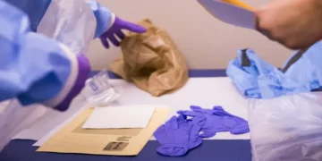 Personal protective equipment is arranged for medical staff during an Ebola response training exercise at an Army health clinic.