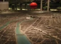 Diorama at Hiroshima Peace Memorial Museum showing the city after the atomic bomb blast, with a red marker indicating the blast location.