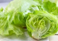 Fresh iceberg lettuce displayed for sale at a grocery store during the CDC investigation into a multistate Cyclospora outbreak linked to recalled lettuce.