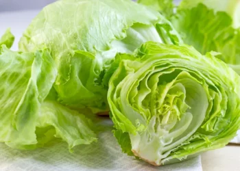 Fresh iceberg lettuce displayed for sale at a grocery store during the CDC investigation into a multistate Cyclospora outbreak linked to recalled lettuce.