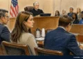 Courtroom sketch showing a judge presiding over a hearing with attorneys seated at counsel tables and spectators in the gallery.
