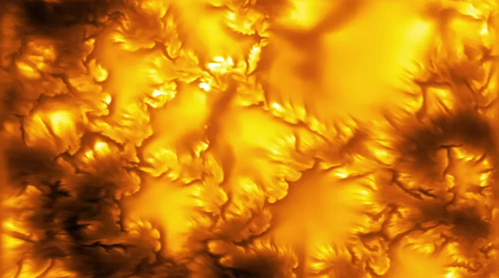 High-resolution image of the Sun's photosphere captured by the NSF Daniel K. Inouye Solar Telescope, revealing fine magnetic structures and plasma patterns linked to Kelvin-Helmholtz instability.