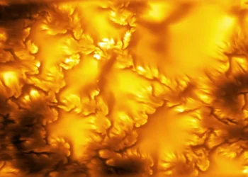 High-resolution image of the Sun's photosphere captured by the NSF Daniel K. Inouye Solar Telescope, revealing fine magnetic structures and plasma patterns linked to Kelvin-Helmholtz instability.