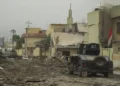 An Iraqi Special Operations Forces armored personnel carrier drives along a street in Mosul during the battle against Islamic State forces.