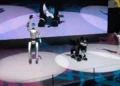Unitree G1 humanoid robot, VISIONOID FOX animanoid and Unitree Go2 robot dog displayed at Japan Mobility Show 2025 in Tokyo.
