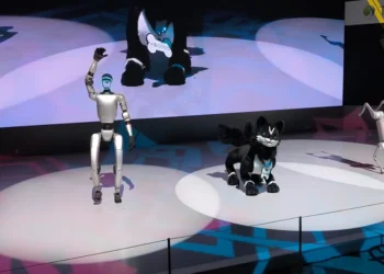 Unitree G1 humanoid robot, VISIONOID FOX animanoid and Unitree Go2 robot dog displayed at Japan Mobility Show 2025 in Tokyo.