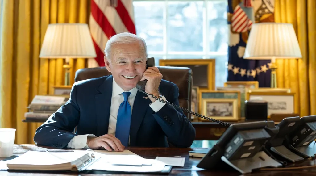 President Joe Biden speaks by phone with Indian Prime Minister Narendra Modi in the Oval Office at the White House.
