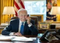 President Joe Biden speaks by phone with Indian Prime Minister Narendra Modi in the Oval Office at the White House.