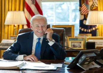 President Joe Biden speaks by phone with Indian Prime Minister Narendra Modi in the Oval Office at the White House.