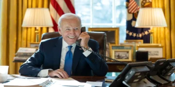 President Joe Biden speaks by phone with Indian Prime Minister Narendra Modi in the Oval Office at the White House.