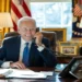 President Joe Biden speaks by phone with Indian Prime Minister Narendra Modi in the Oval Office at the White House.