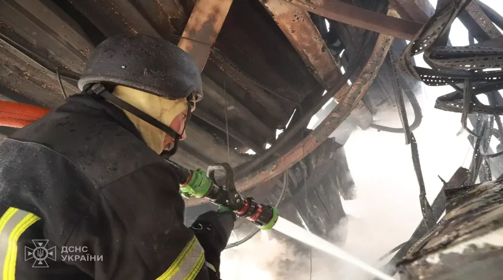 Emergency responders inspect damage after a Russian mass attack on Kyiv, with casualties and destruction reported by Ukraine's emergency service.