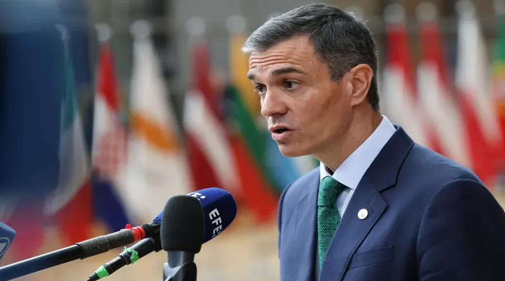 Spanish Prime Minister Pedro Sánchez attends a European Union summit, wearing a dark suit and tie during an official event.
