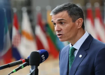 Spanish Prime Minister Pedro Sánchez attends a European Union summit, wearing a dark suit and tie during an official event.