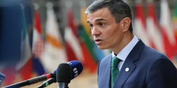 Spanish Prime Minister Pedro Sánchez attends a European Union summit, wearing a dark suit and tie during an official event.