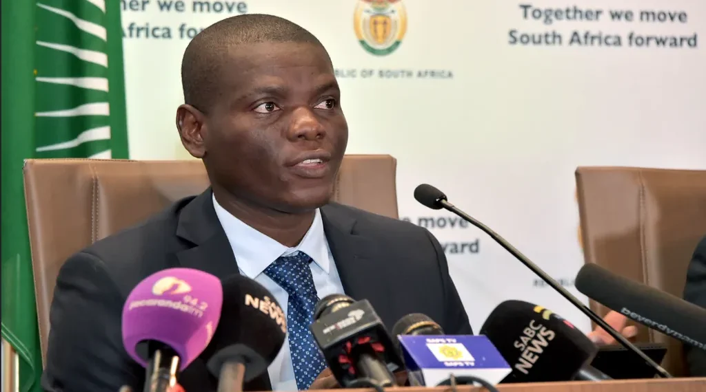 South African Ministers Ronald Lamola and Bheki Cele address a media briefing on government measures to combat the COVID-19 pandemic.