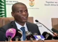 South African Ministers Ronald Lamola and Bheki Cele address a media briefing on government measures to combat the COVID-19 pandemic.