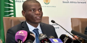 South African Ministers Ronald Lamola and Bheki Cele address a media briefing on government measures to combat the COVID-19 pandemic.