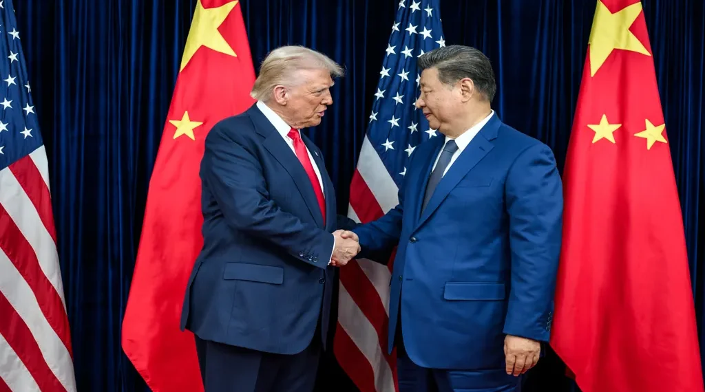 U.S. President Donald Trump greets Chinese leader Xi Jinping before a bilateral meeting in Busan, South Korea.