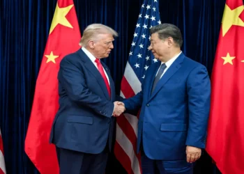 U.S. President Donald Trump greets Chinese leader Xi Jinping before a bilateral meeting in Busan, South Korea.