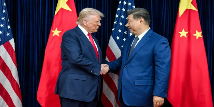 U.S. President Donald Trump greets Chinese leader Xi Jinping before a bilateral meeting in Busan, South Korea.